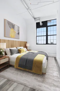 a bedroom with bed and window