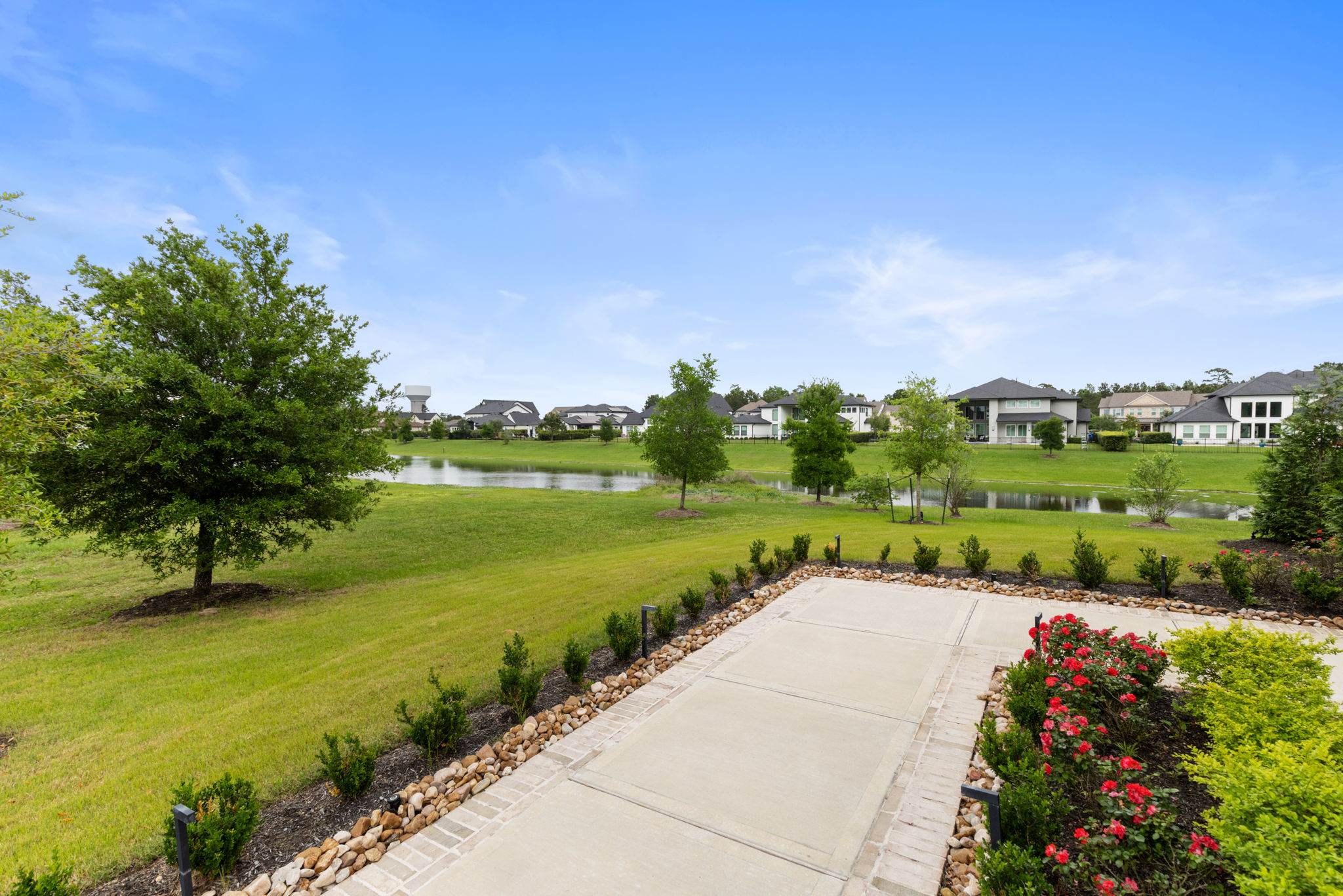 2118 Bennet Court Conroe, TX 77384 - Photo 5 of 70 a view of a lake with a garden
