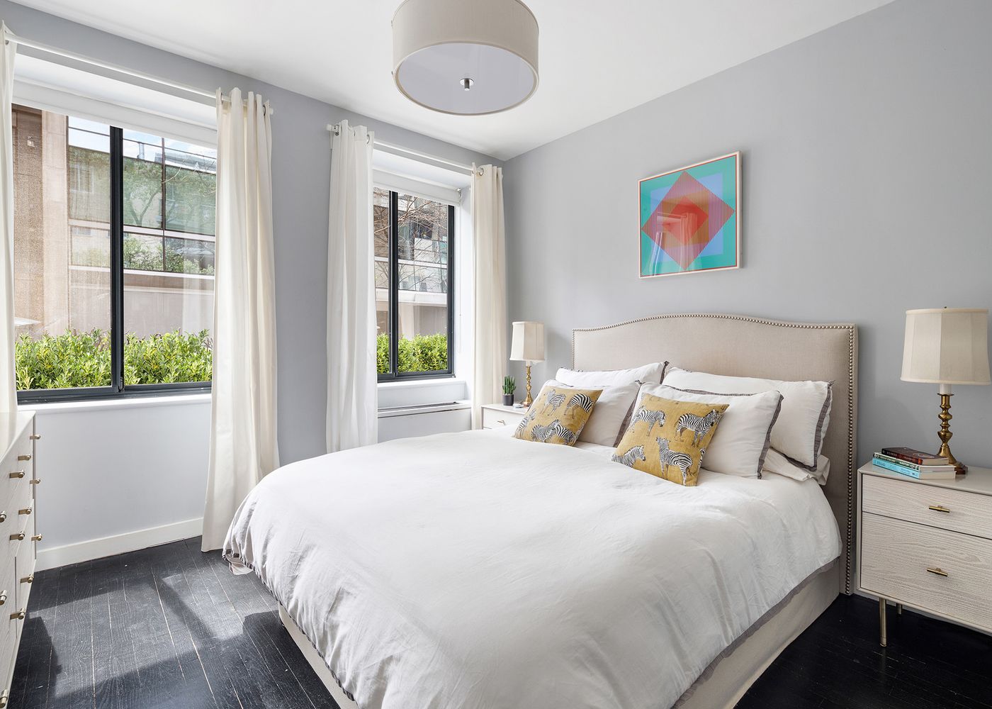 167 Perry Street, Unit 2F Manhattan, NY 10014 - Photo 4 of 11 a bedroom with a bed and a large window