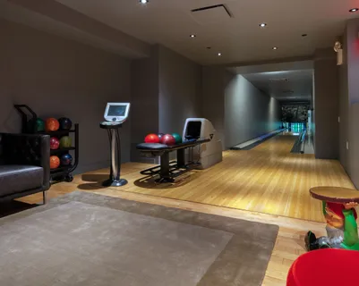 a room with gym equipment and a table