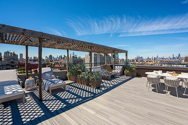 275 Park Avenue, Unit 2HH Brooklyn, NY 11205 - Photo 5 of 11 a view of a chairs and table in patio with a barbeque grill