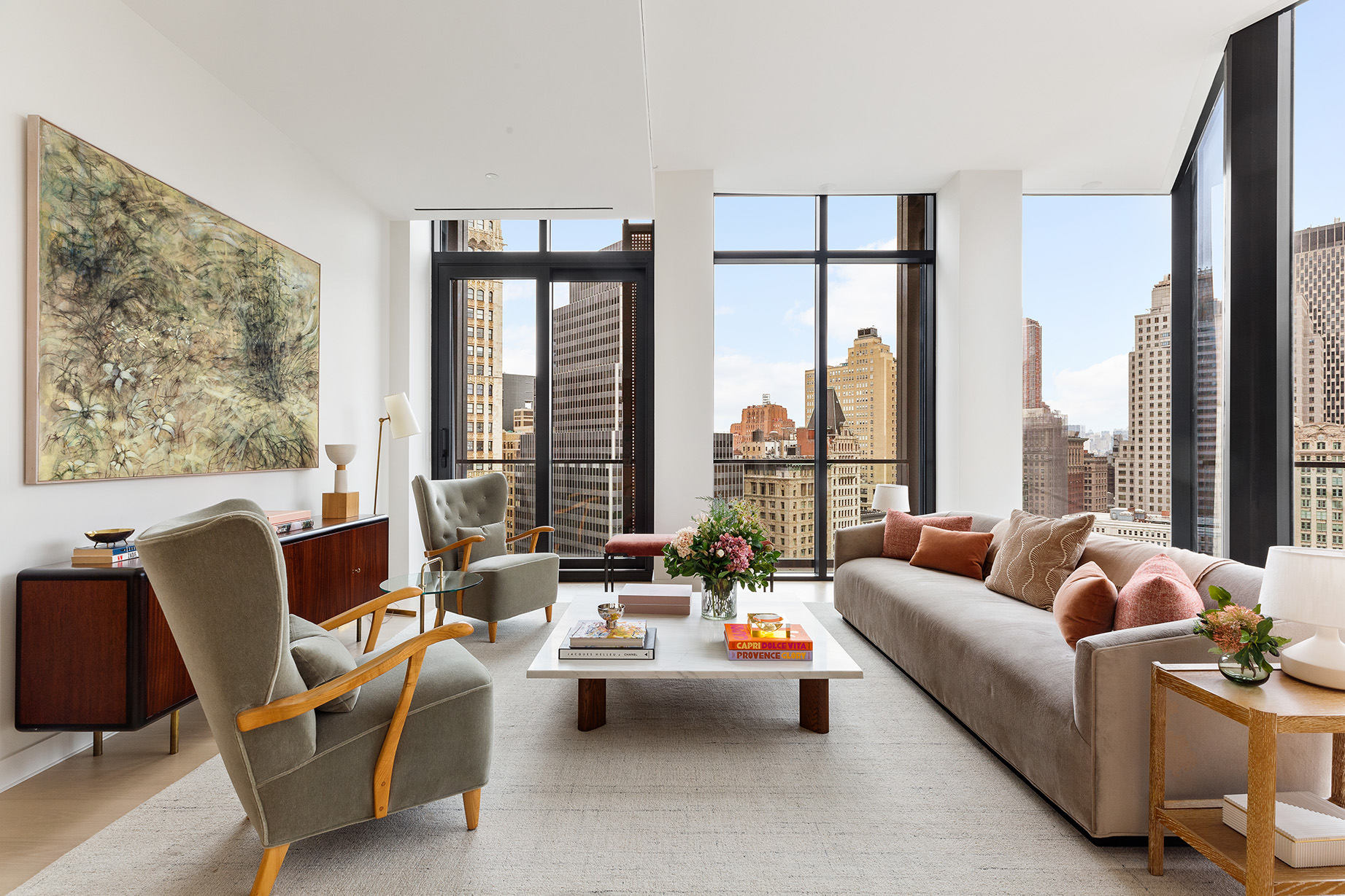33 Park Row, Unit 18B Manhattan, NY 10038 - Photo 2 of 19 a living room with furniture and floor to ceiling windows