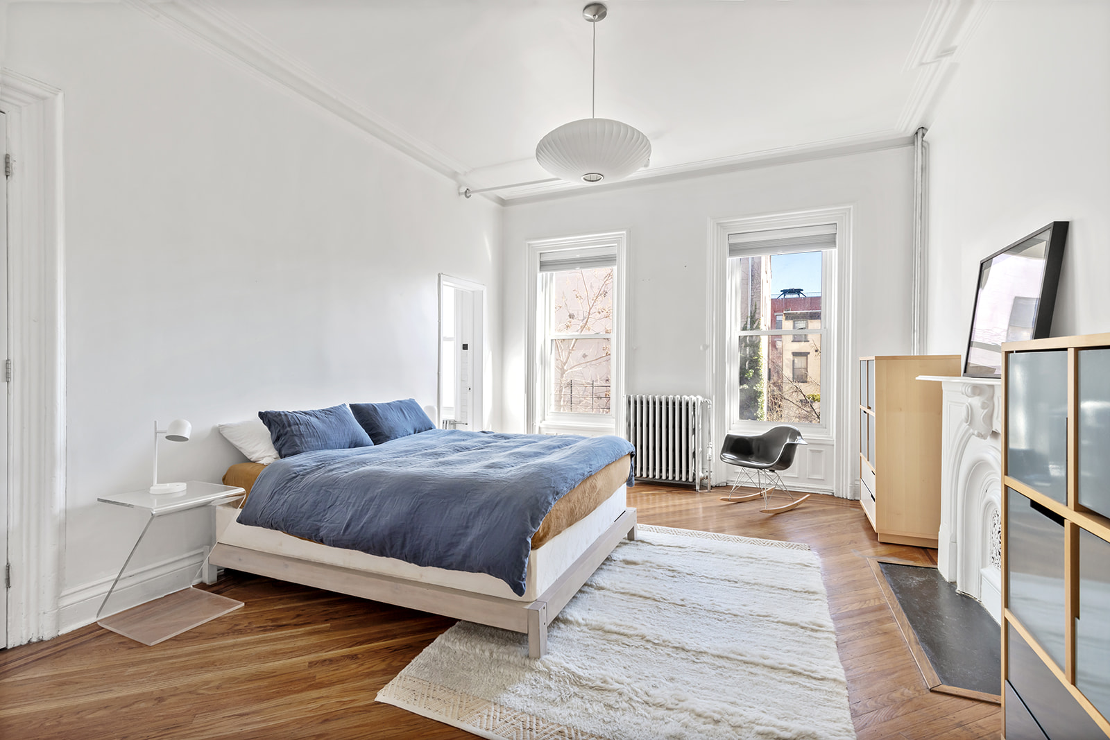 166 Washington Park, Unit 2 Brooklyn, NY 11205 - Photo 3 of 9 a bedroom with a bed and a couch