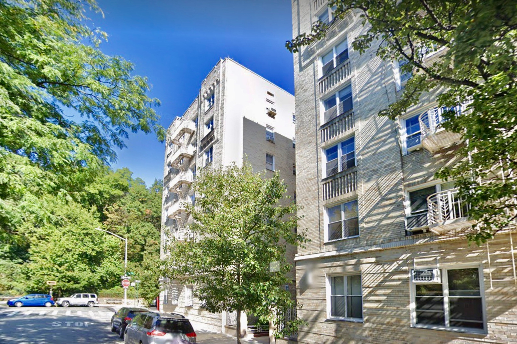 91 Payson Avenue, Unit 4D Manhattan, NY 10034 - Photo 15 of 24 a view of a tall building next to a road