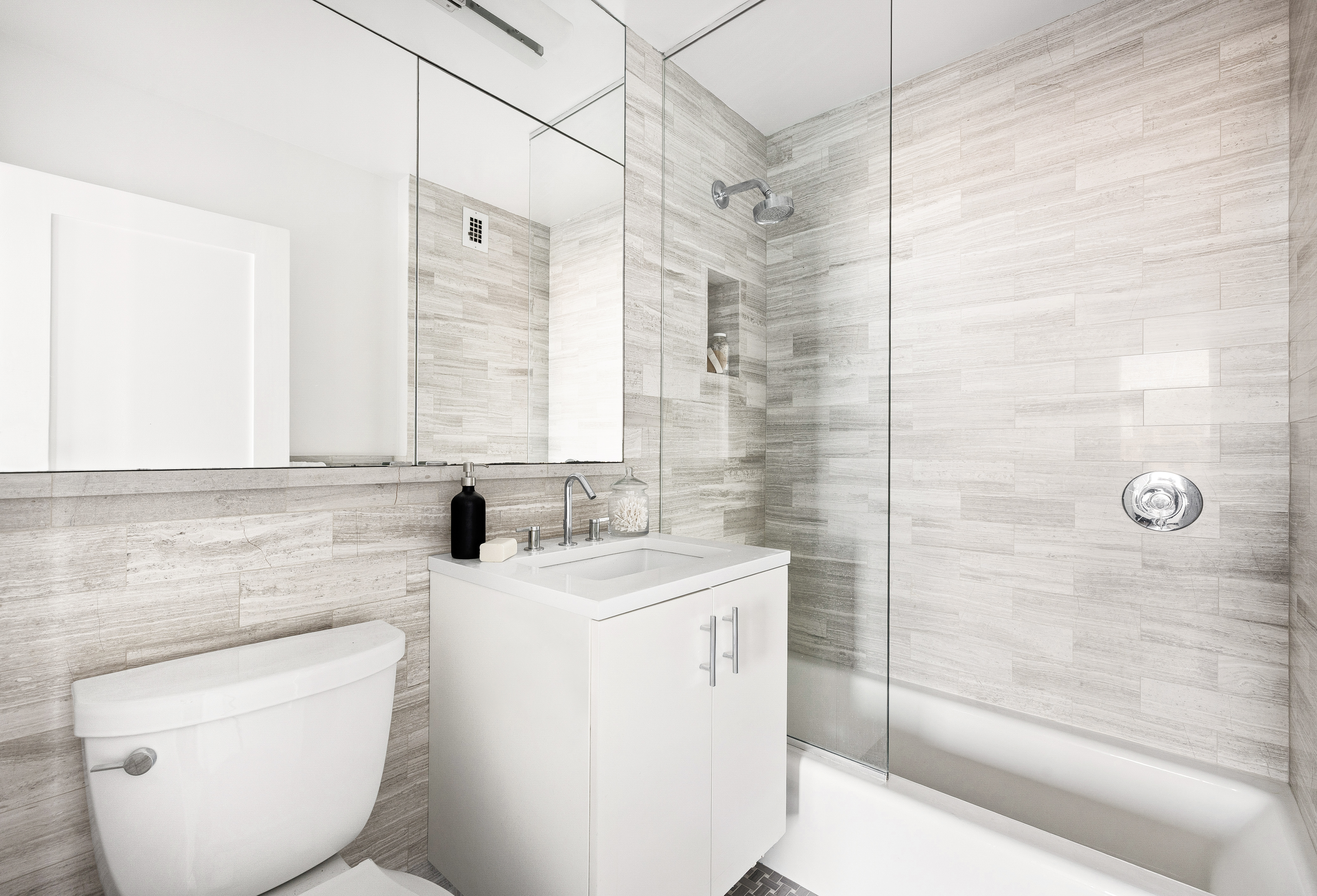 1623 3rd Avenue, Unit 36A Manhattan, NY 10128 - Photo 8 of 17 a bathroom with a sink a toilet and shower