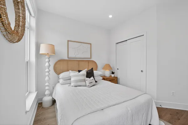 a bedroom with a bed and a window