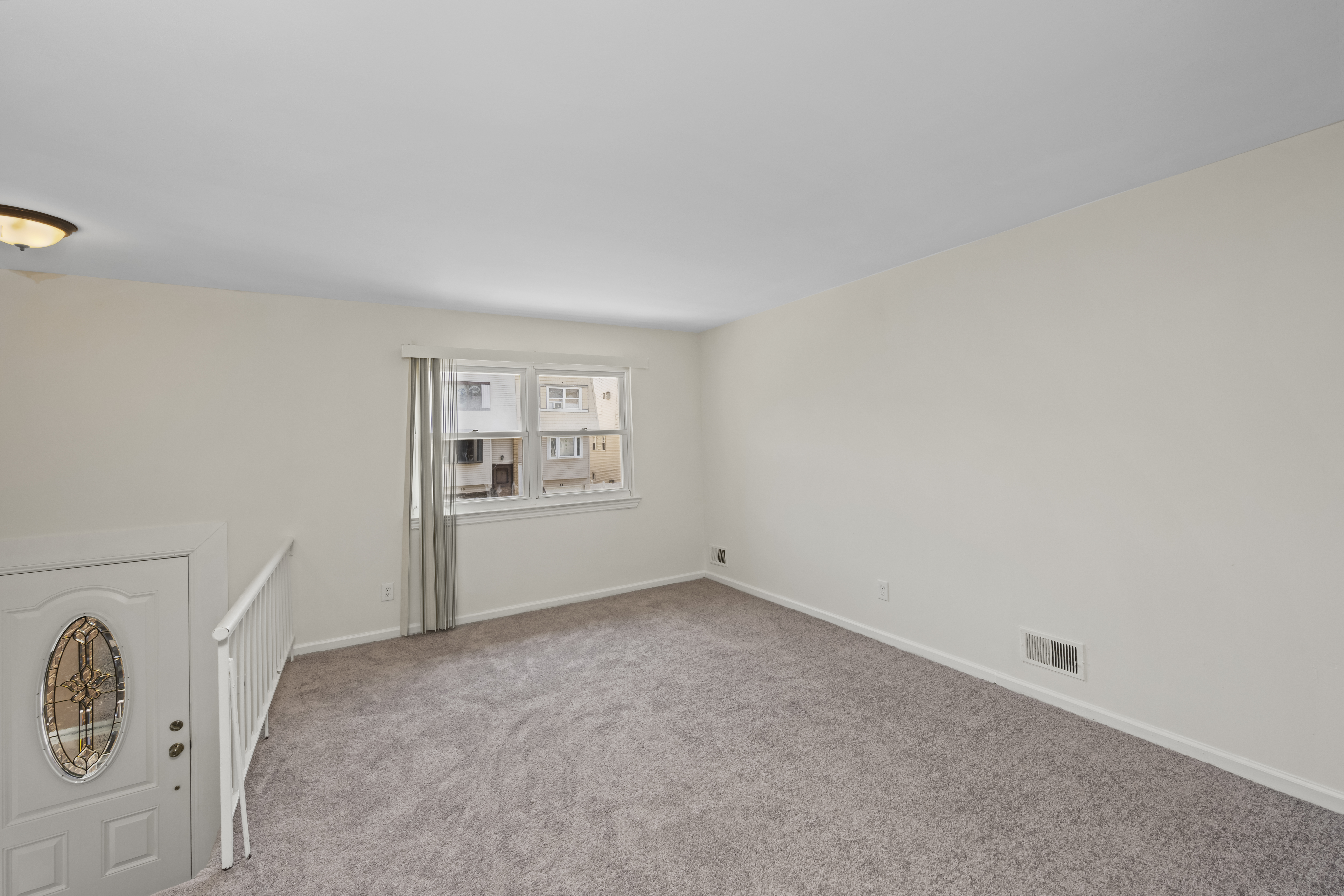 12 Yucca Drive Staten Island, NY 10312 - Photo 4 of 21 an empty room with windows