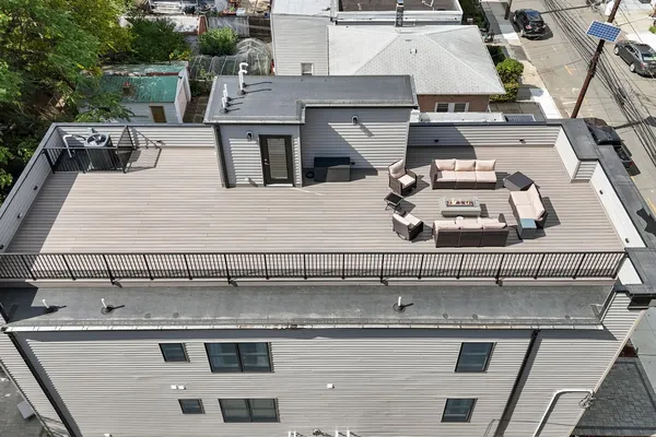 an aerial view of a building with garage
