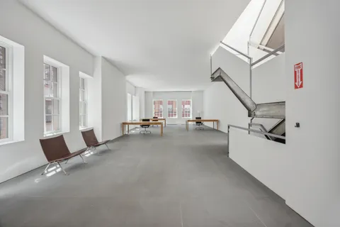 a view of livingroom with furniture and floor to ceiling window