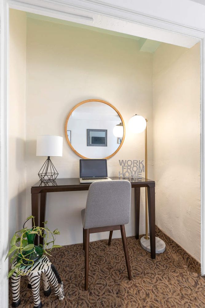 205 East 78th Street, Unit 8S Manhattan, NY 10075 - Photo 4 of 7 a view of workspace with a table chair and a window