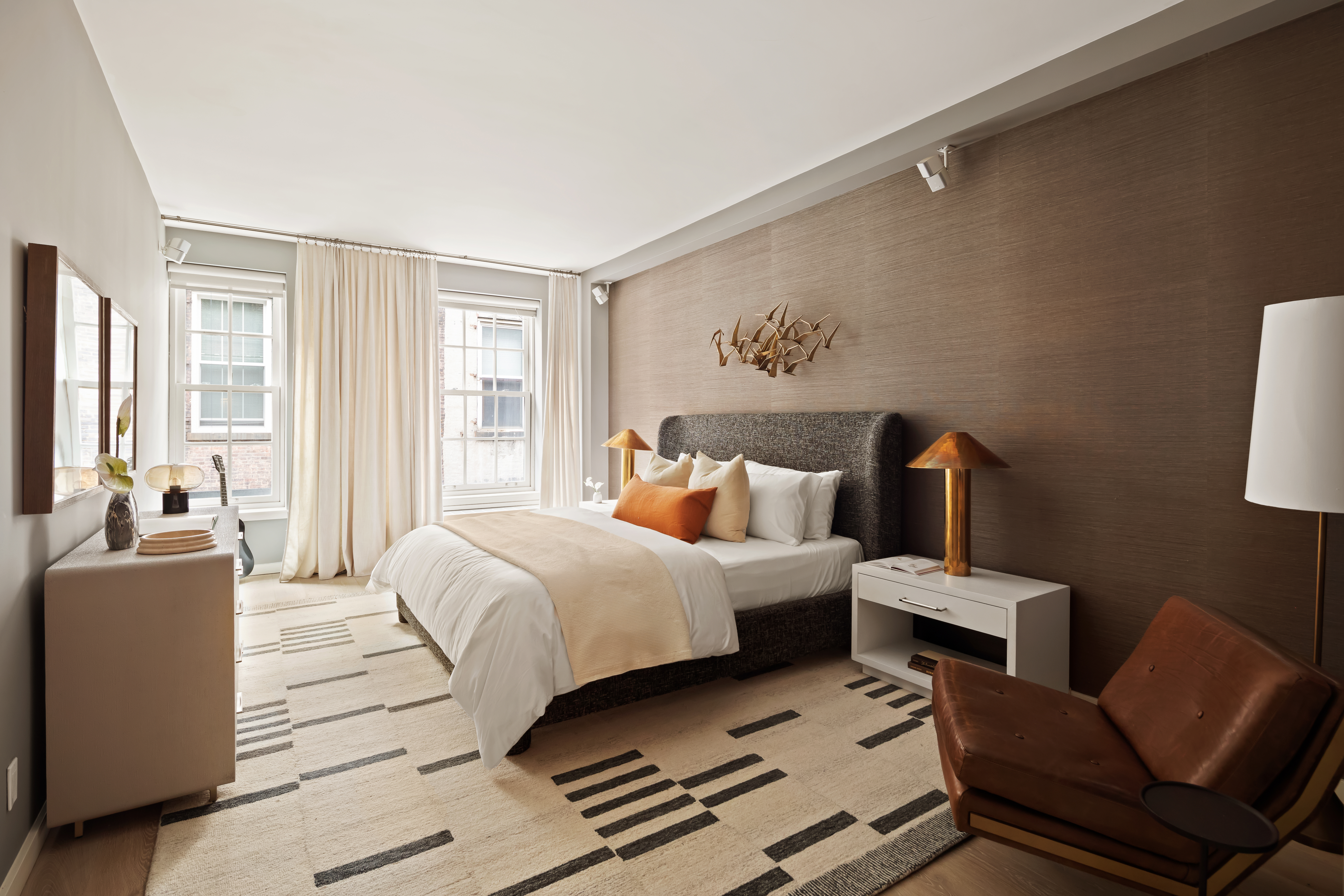 115 Mercer Street, Unit 4A Manhattan, NY 10012 - Photo 9 of 15 a bedroom with a bed and a couch