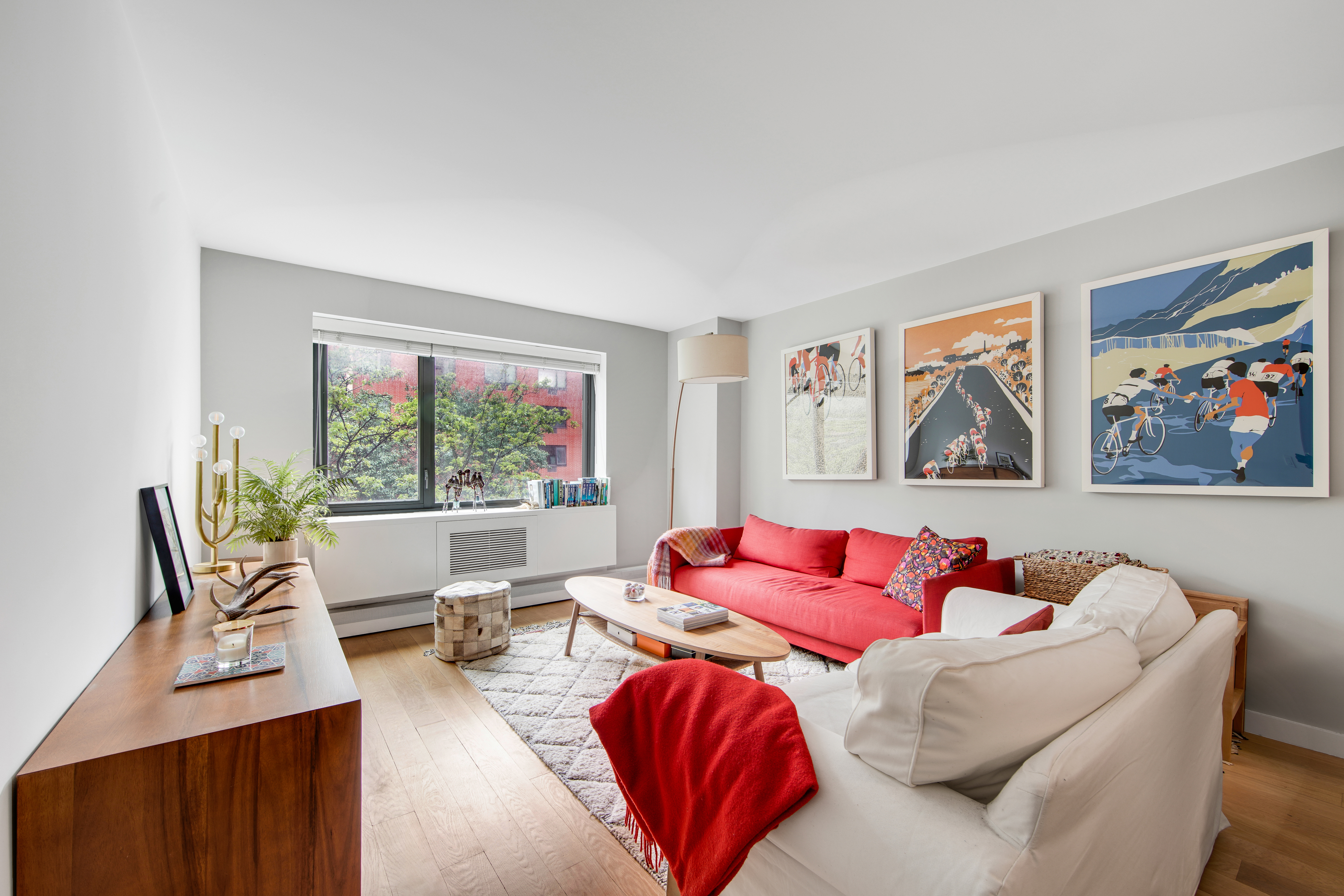 1330 5th Avenue, Unit 3F Manhattan, NY 10026 - Photo 2 of 16 a living room with furniture large window and couch