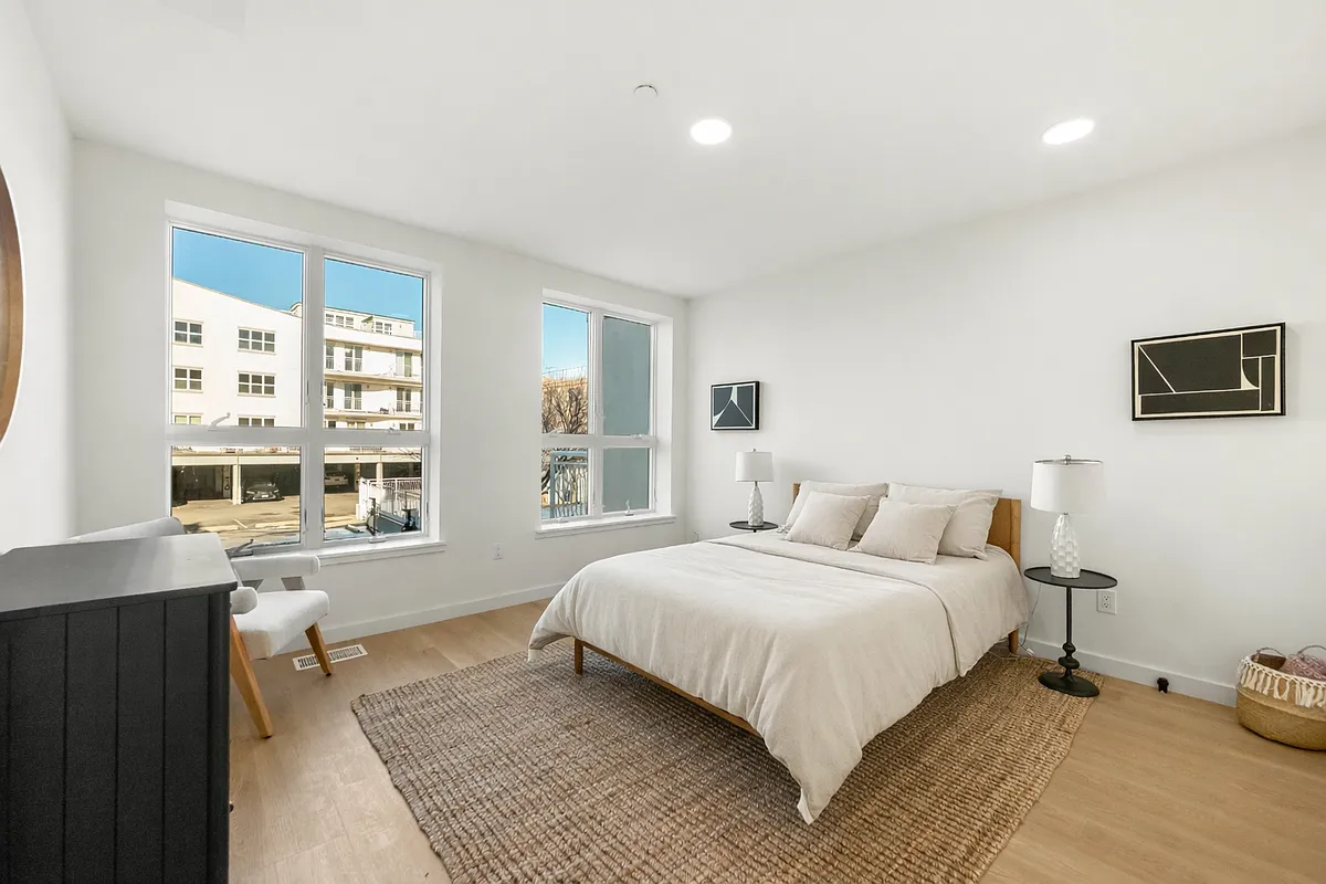 3112 Emmons Avenue, Unit 3132-2 Brooklyn, NY 11235 - Photo 6 of 11 a bedroom with a bed and a window