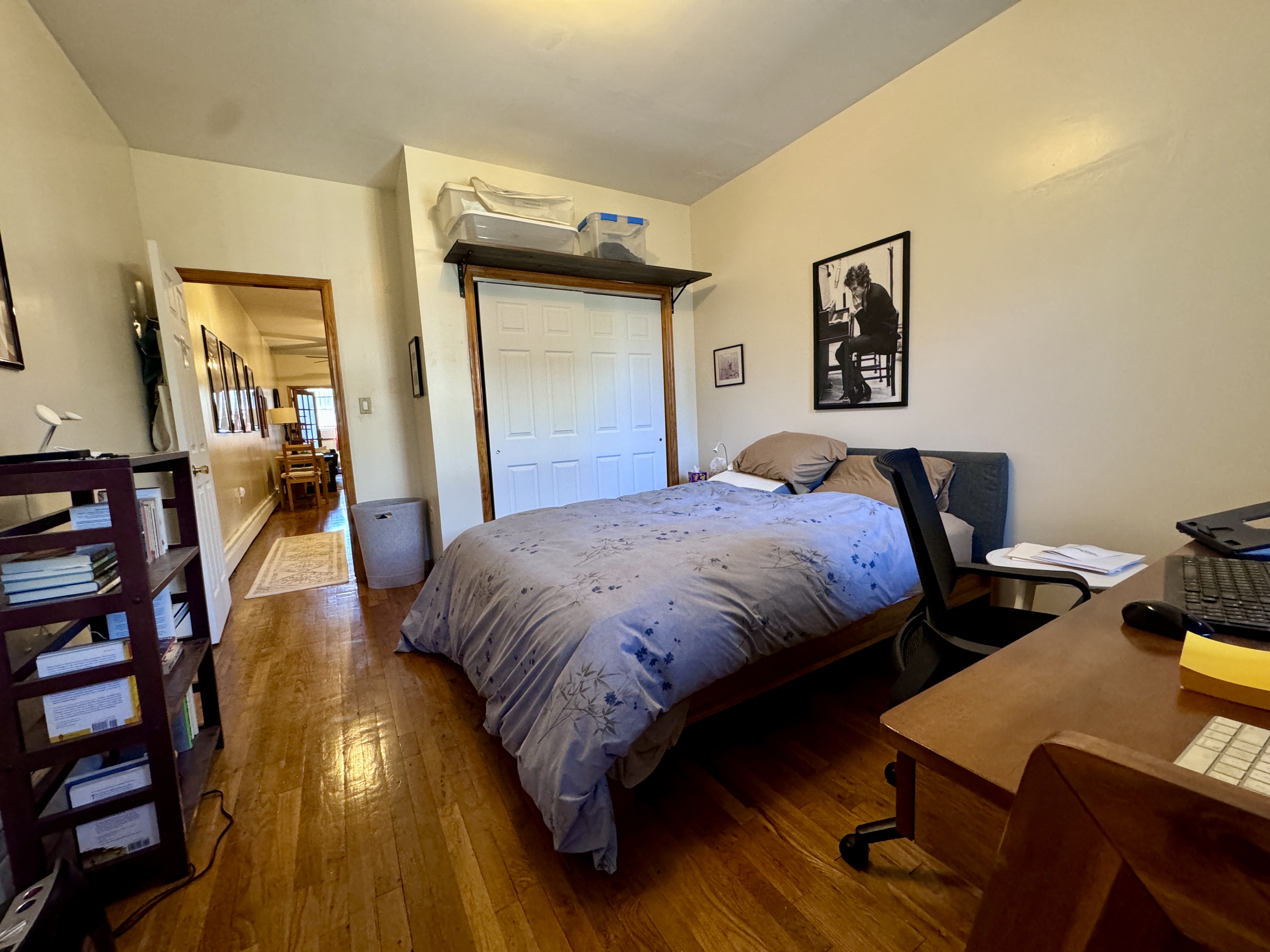 379 Baltic Street, Unit Undisclosed Brooklyn, NY 11201 - Photo 3 of 10 a bedroom with bed and wooden floor