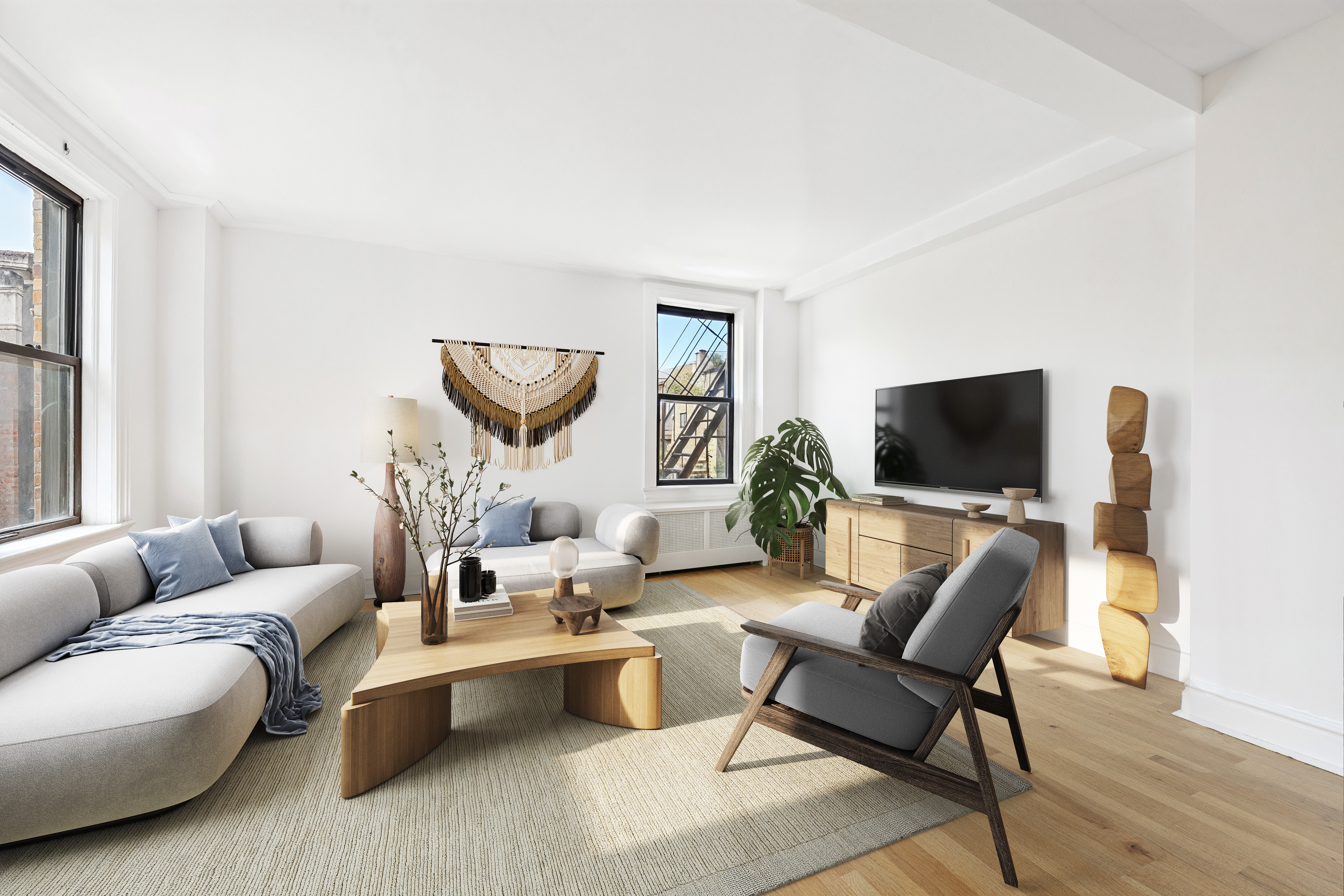 473 West End Avenue, Unit 13D Manhattan, NY 10024 - Photo 3 of 13 a living room with furniture and a flat screen tv