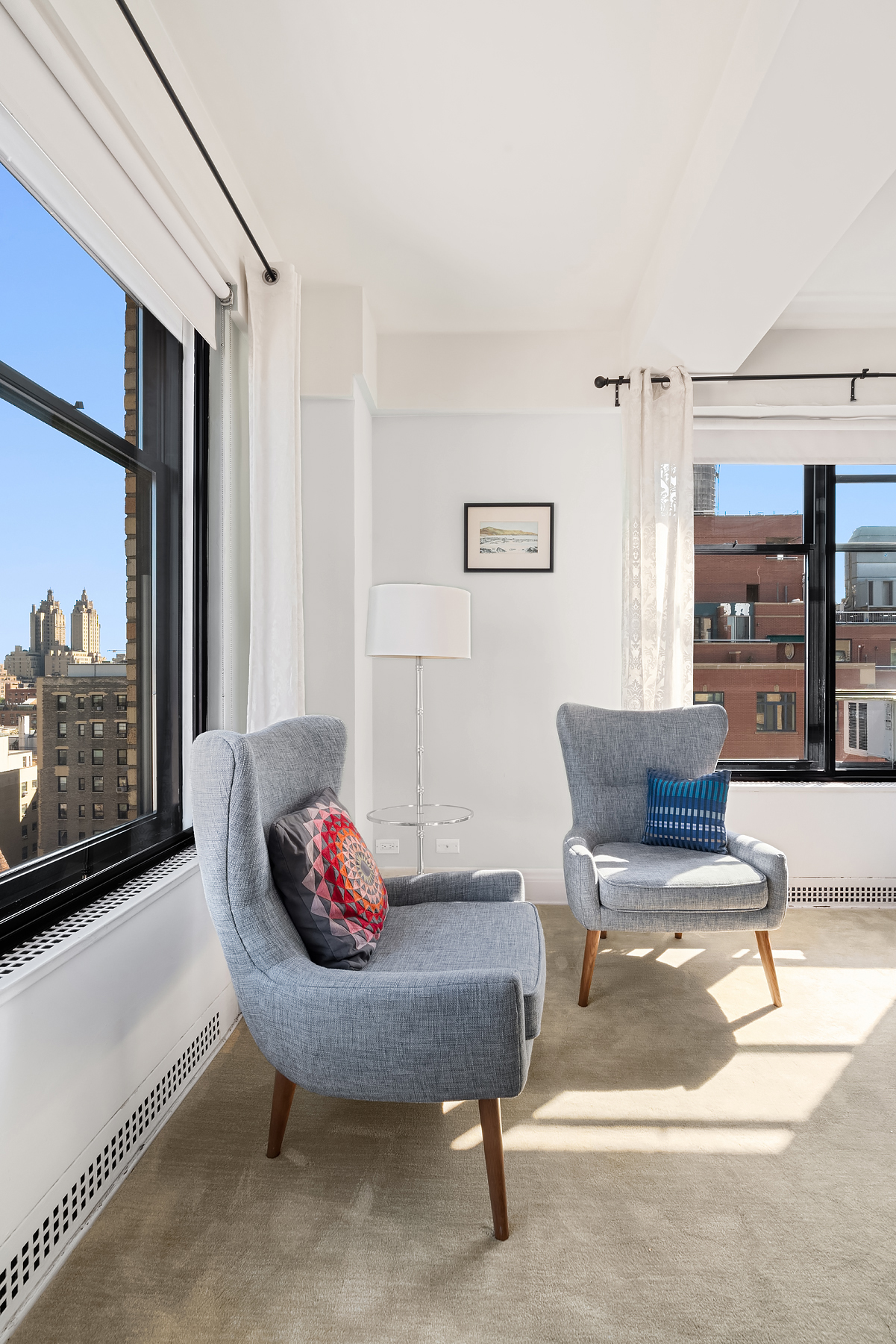 200 West 86th Street, Unit 17C Manhattan, NY 10024 - Photo 6 of 15 a living room with furniture and a floor to ceiling window