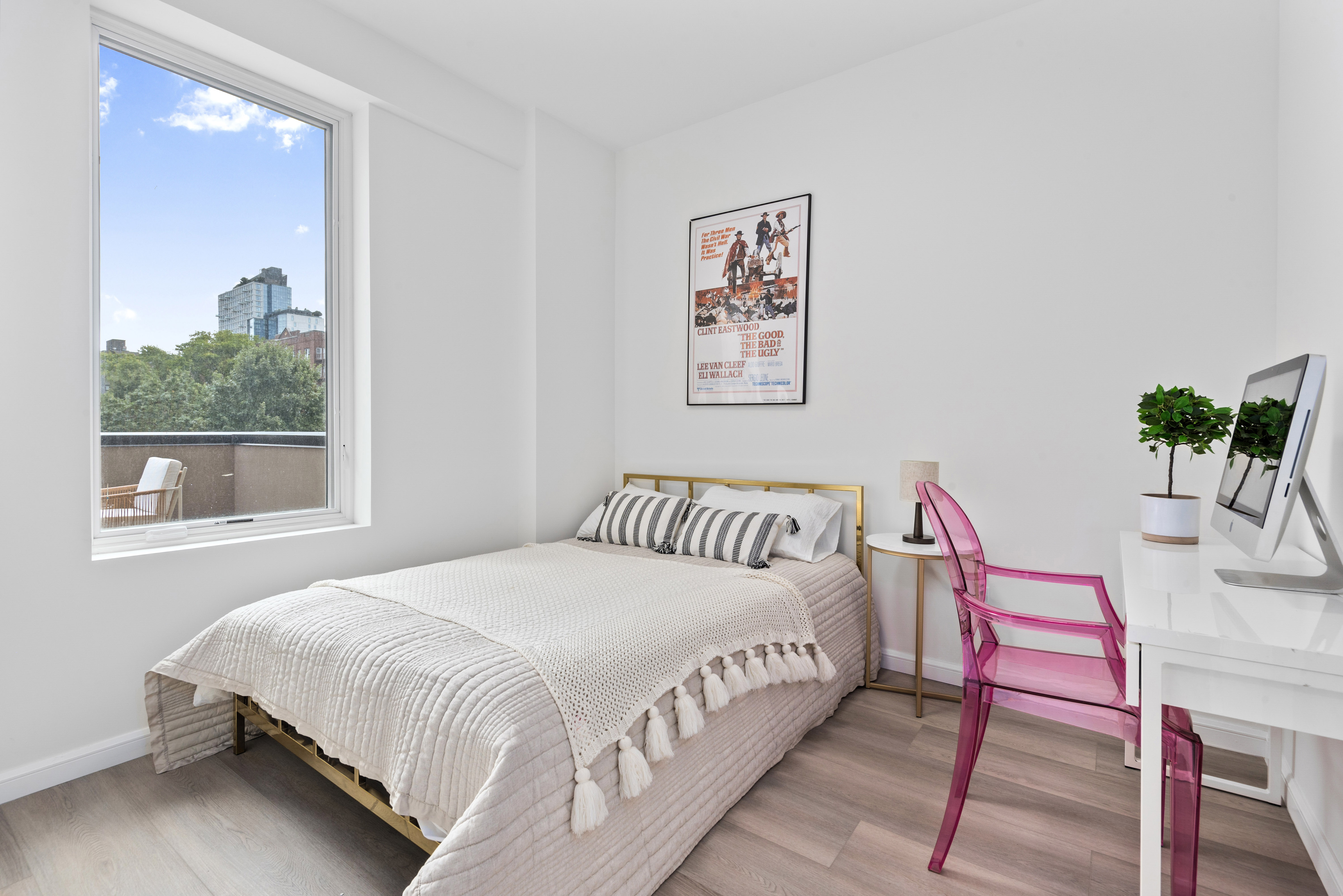 1 Lenox Road, Unit 2B Brooklyn, NY 11226 - Photo 2 of 6 a bedroom with a bed and a potted plant