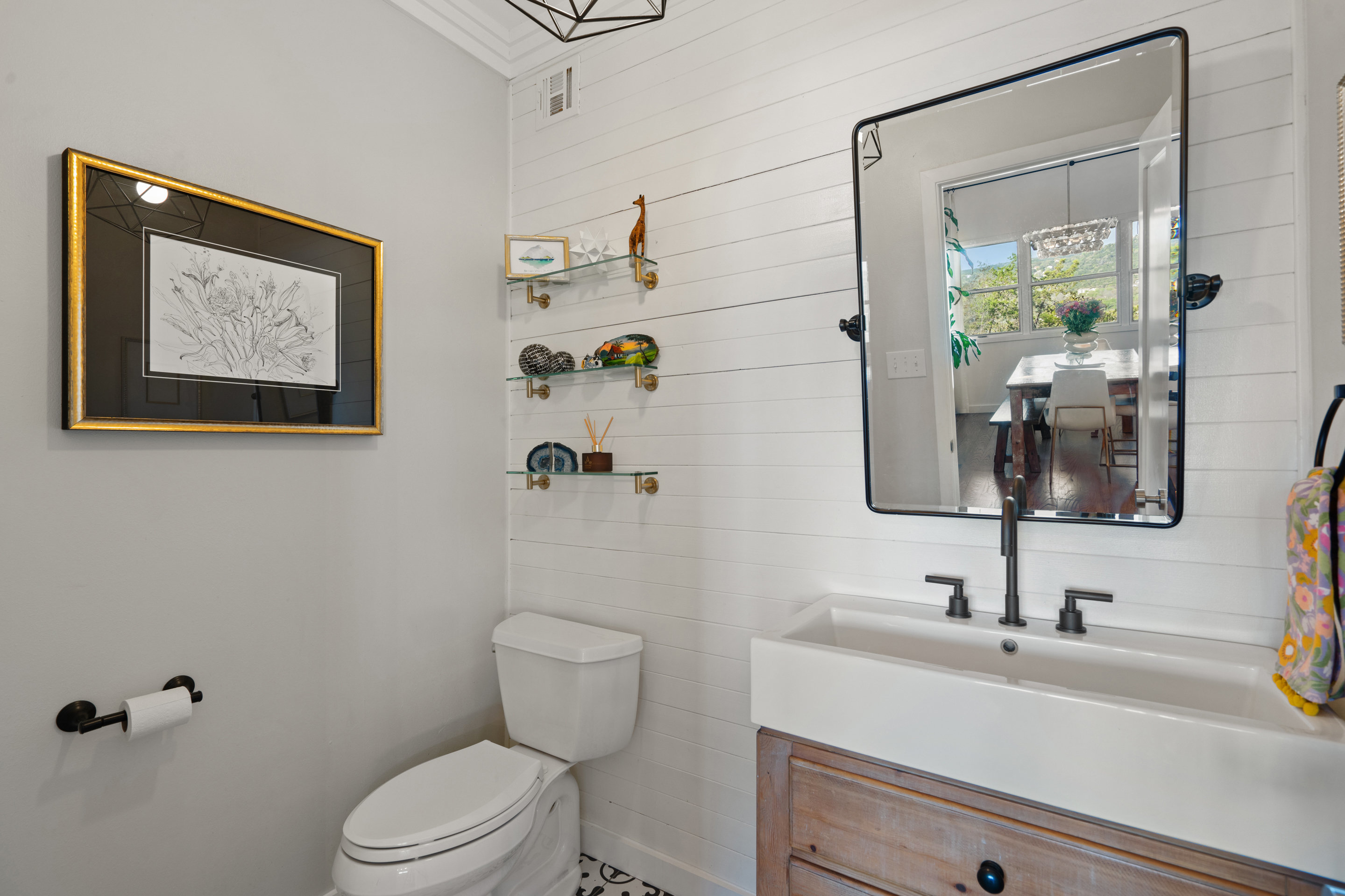 5319 Backtrail Drive Austin, TX 78731 - Photo 23 of 35 a bathroom with a sink mirror vanity and toilet