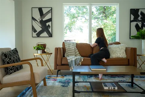 a bedroom with a bed and a chair