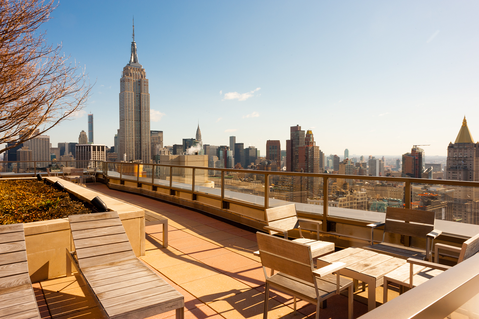 101 West 24th Street, Unit 16D Manhattan, NY 10011 - Photo 16 of 23 a view of a terrace with wooden benches