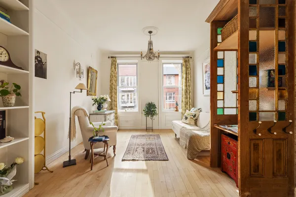 a living room with furniture rug and window
