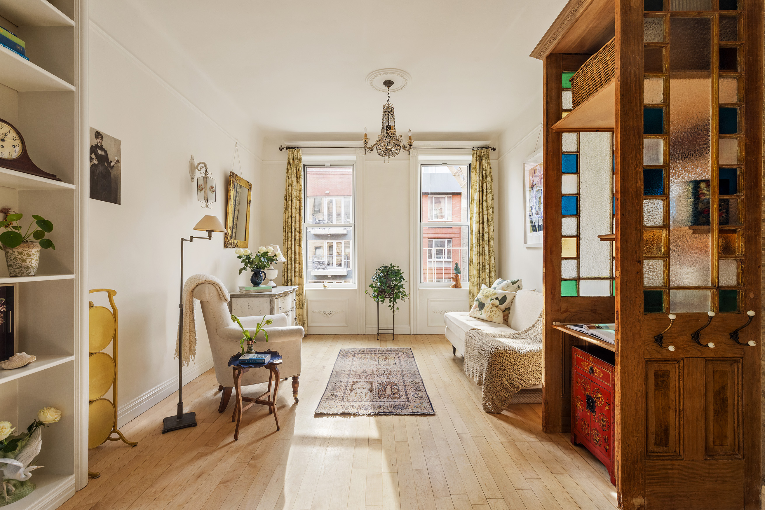 a living room with furniture rug and window