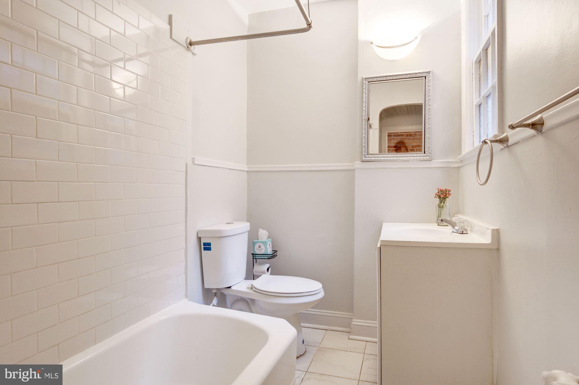 731 13th Street Northeast Washington, DC 20002 - Photo 35 of 43 a bathroom with a sink a toilet and shower
