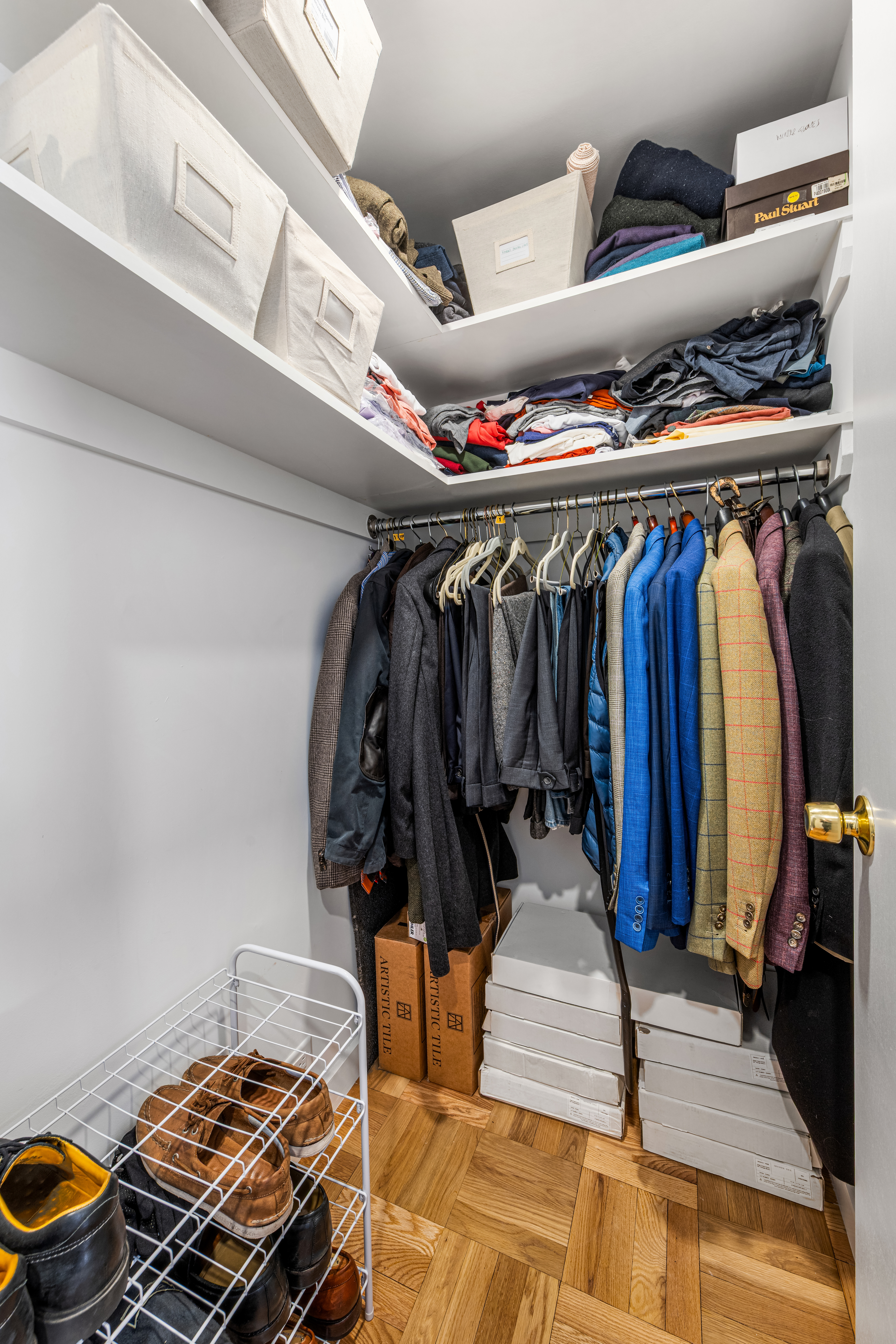 324 East 41st Street, Unit 1103C Manhattan, NY 10017 - Photo 12 of 13 a view of walk in closet with clothes and shoes