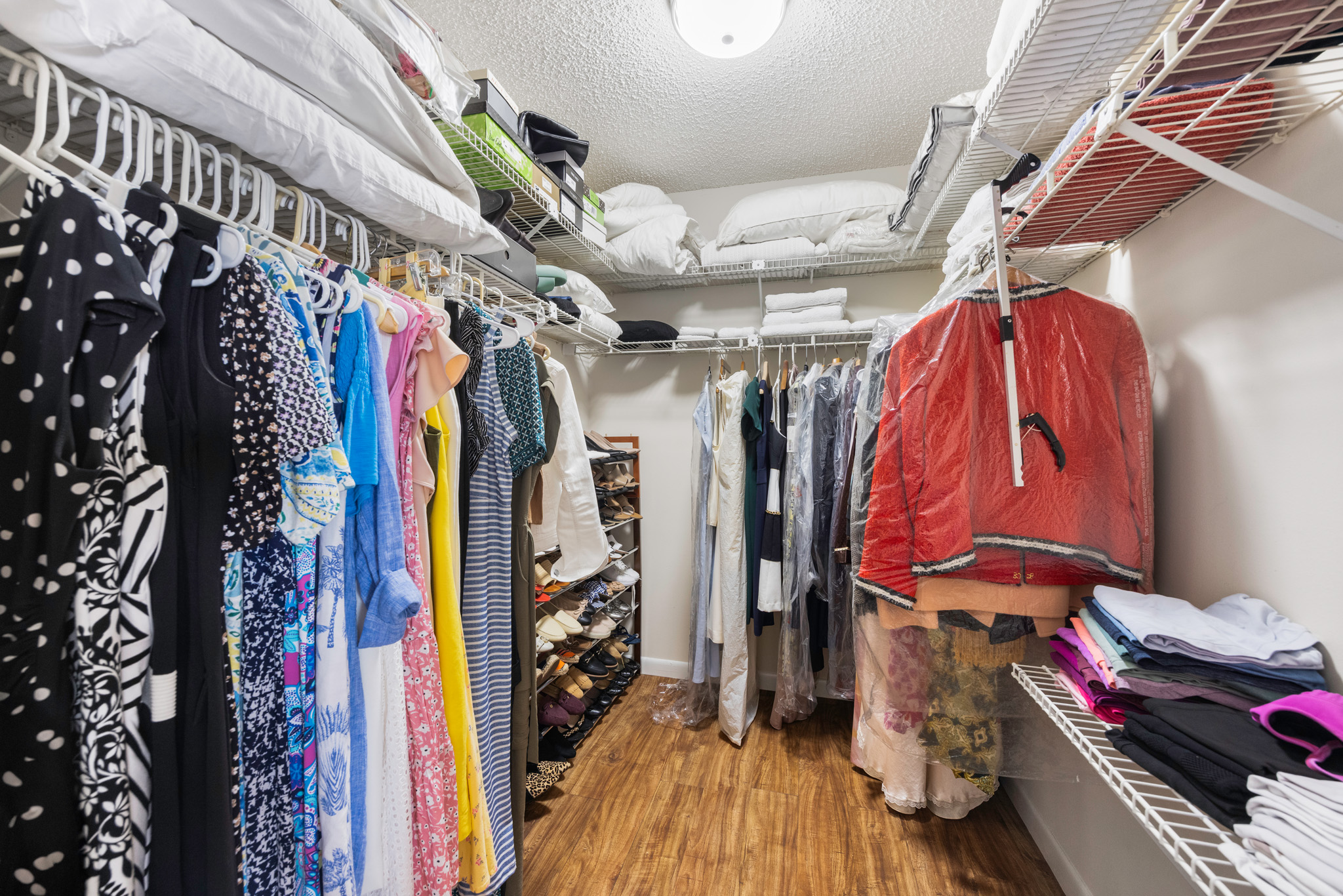 8610 Southwest 83rd Street Miami, FL 33143 - Photo 19 of 46 a view of walk in closet with clothes