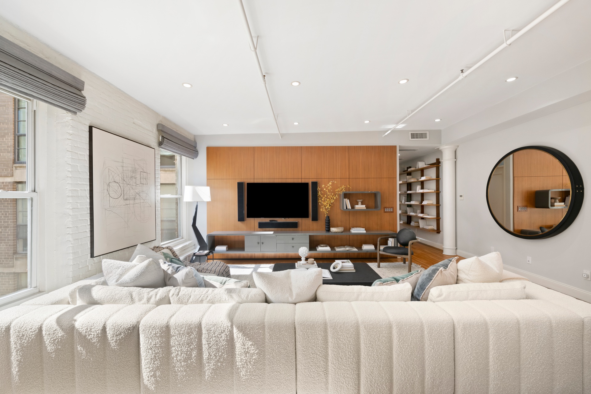 30 West 13th Street, Unit 4C Manhattan, NY 10011 - Photo 6 of 22 a bedroom with a bed and a flat screen tv