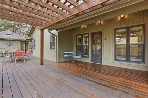 a view of outdoor space with wooden floor and seating