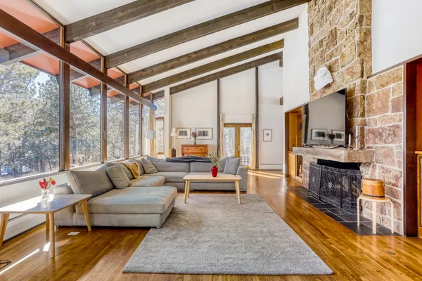 a dining hall with stainless steel appliances a dining table and chairs with wooden floor