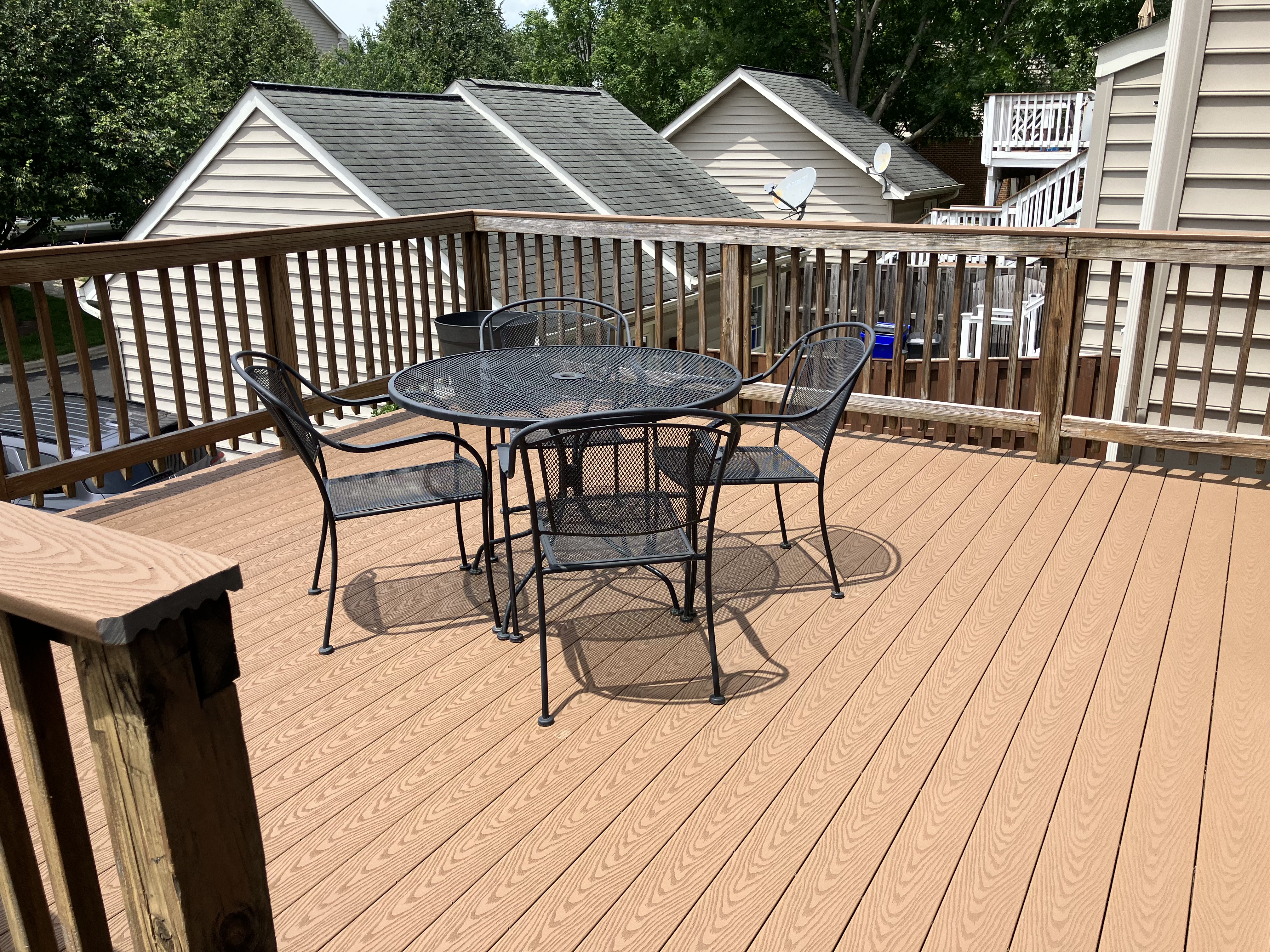 3814 Addison Woods Road Frederick, MD 21704 - Photo 17 of 22 a view of a roof deck with table and chairs with wooden floor and fence