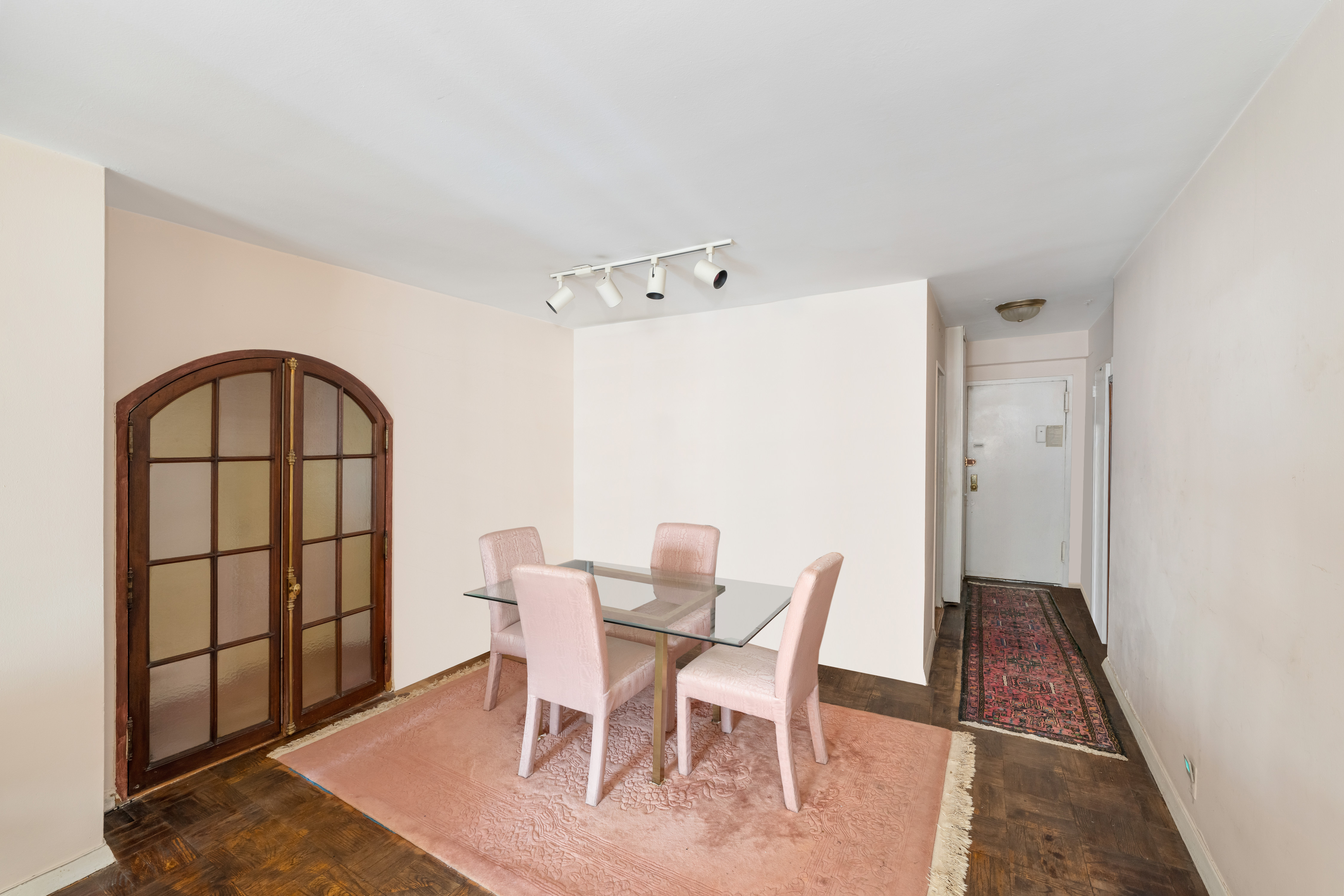 345 East 56th Street, Unit 5C Manhattan, NY 10022 - Photo 3 of 10 a view of a dining room with furniture and a window