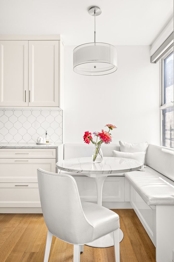240 West End Avenue, Unit PH Manhattan, NY 10023 - Photo 5 of 25 a living room with kitchen island granite countertop furniture and a chandelier