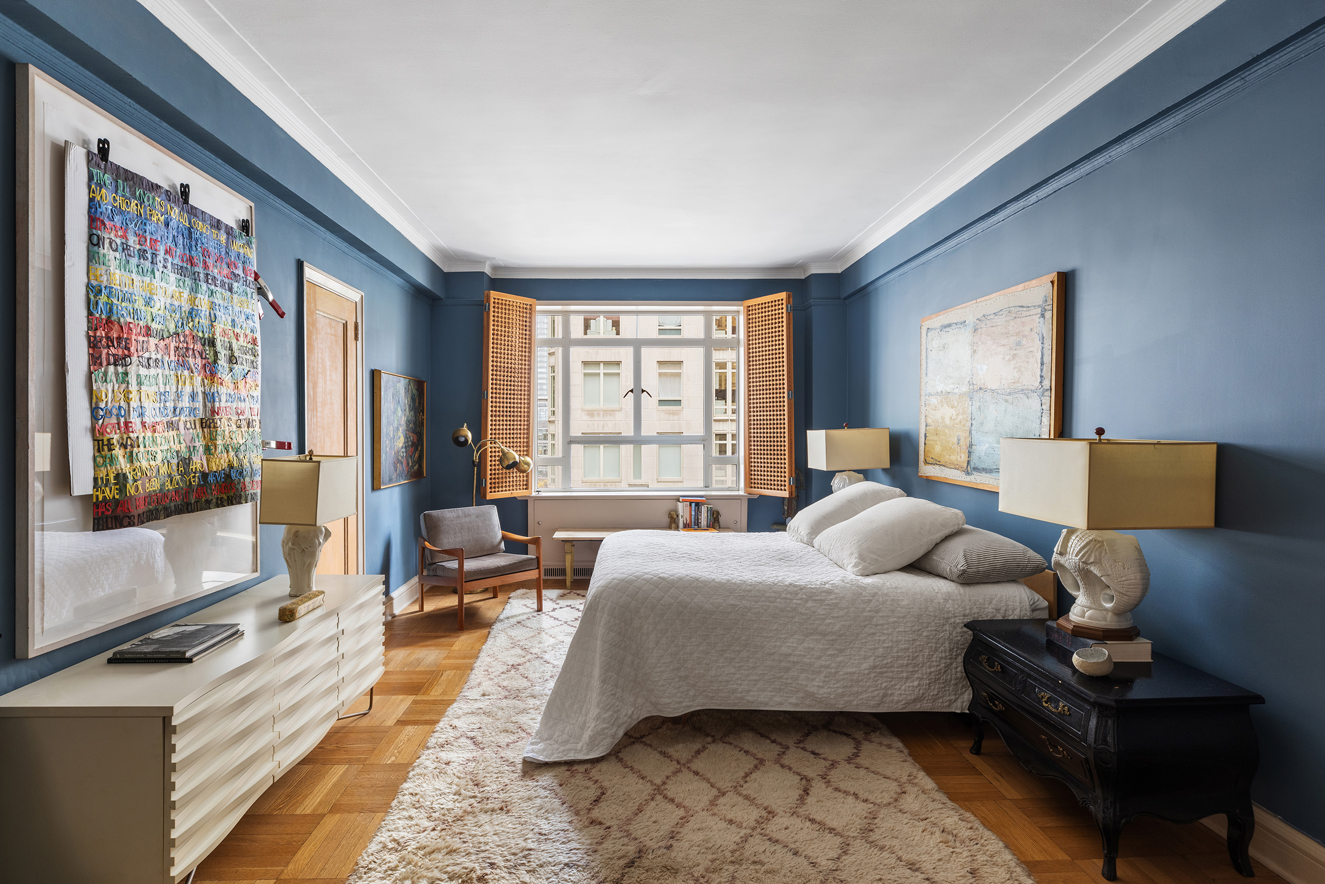 25 Central Park West, Unit 11C Manhattan, NY 10023 - Photo 6 of 17 a bedroom with a bed and glass window