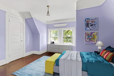 a bedroom with a bed and window