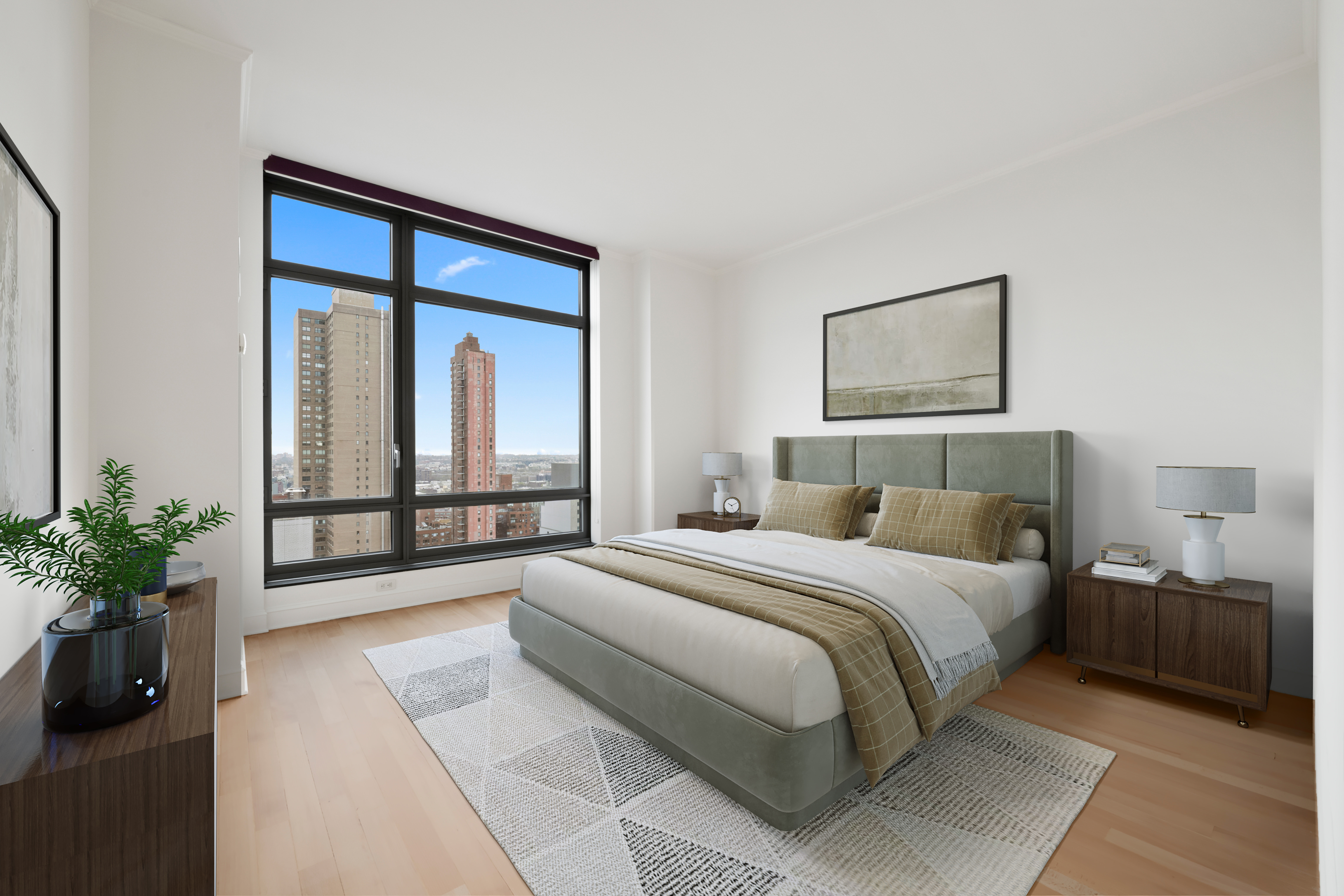 450 East 83rd Street, Unit 23B Manhattan, NY 10028 - Photo 7 of 18 a bedroom with a large bed and a potted plant