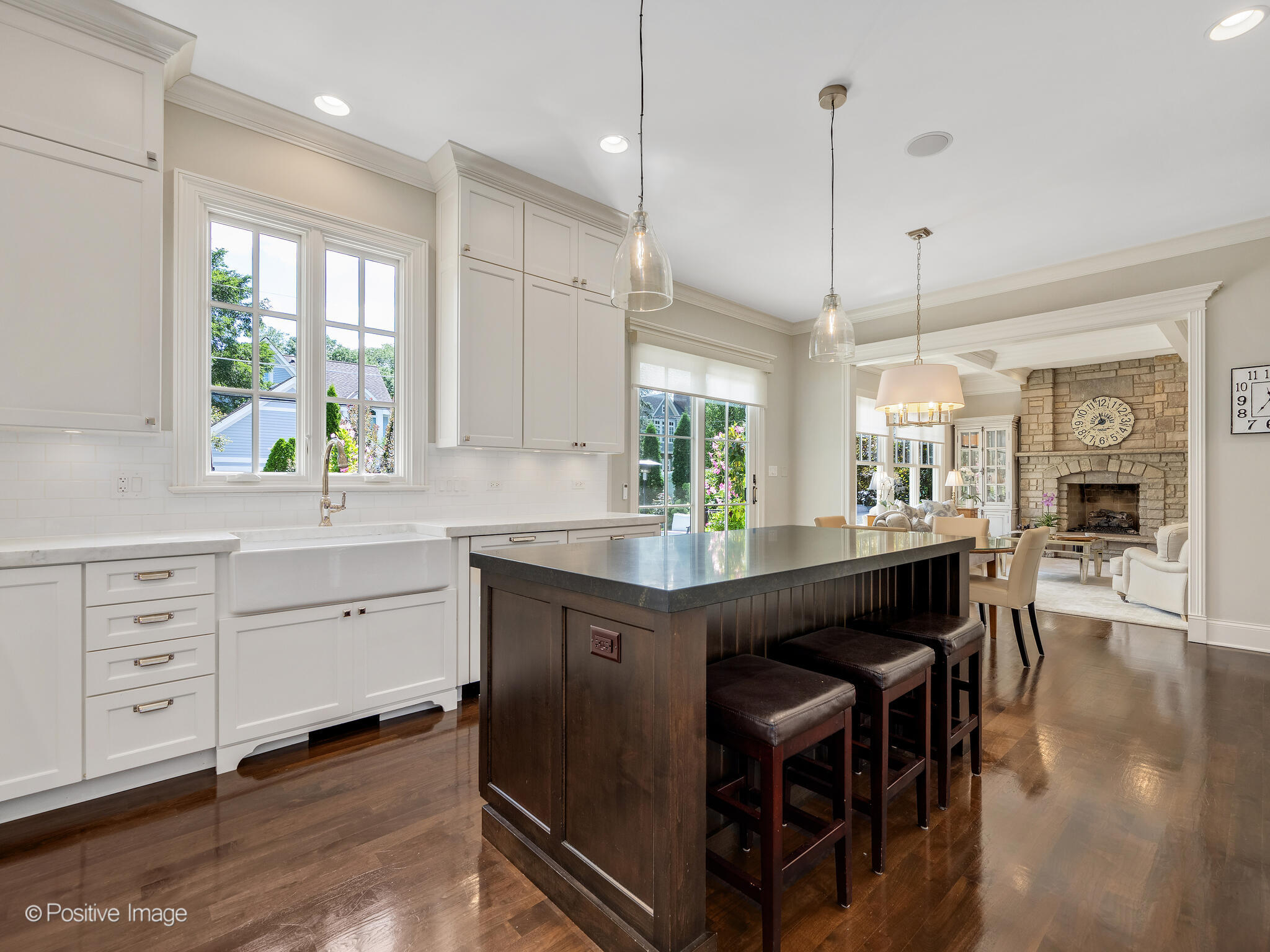 17 South Bruner Street Hinsdale, IL 60521 - Photo 13 of 42 a kitchen with stainless steel appliances granite countertop a table chairs sink and window