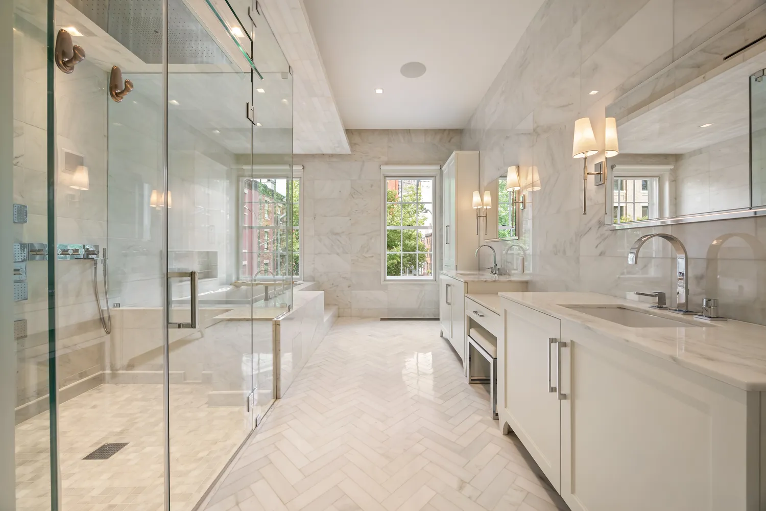 a bedroom with a bed couch tv and window