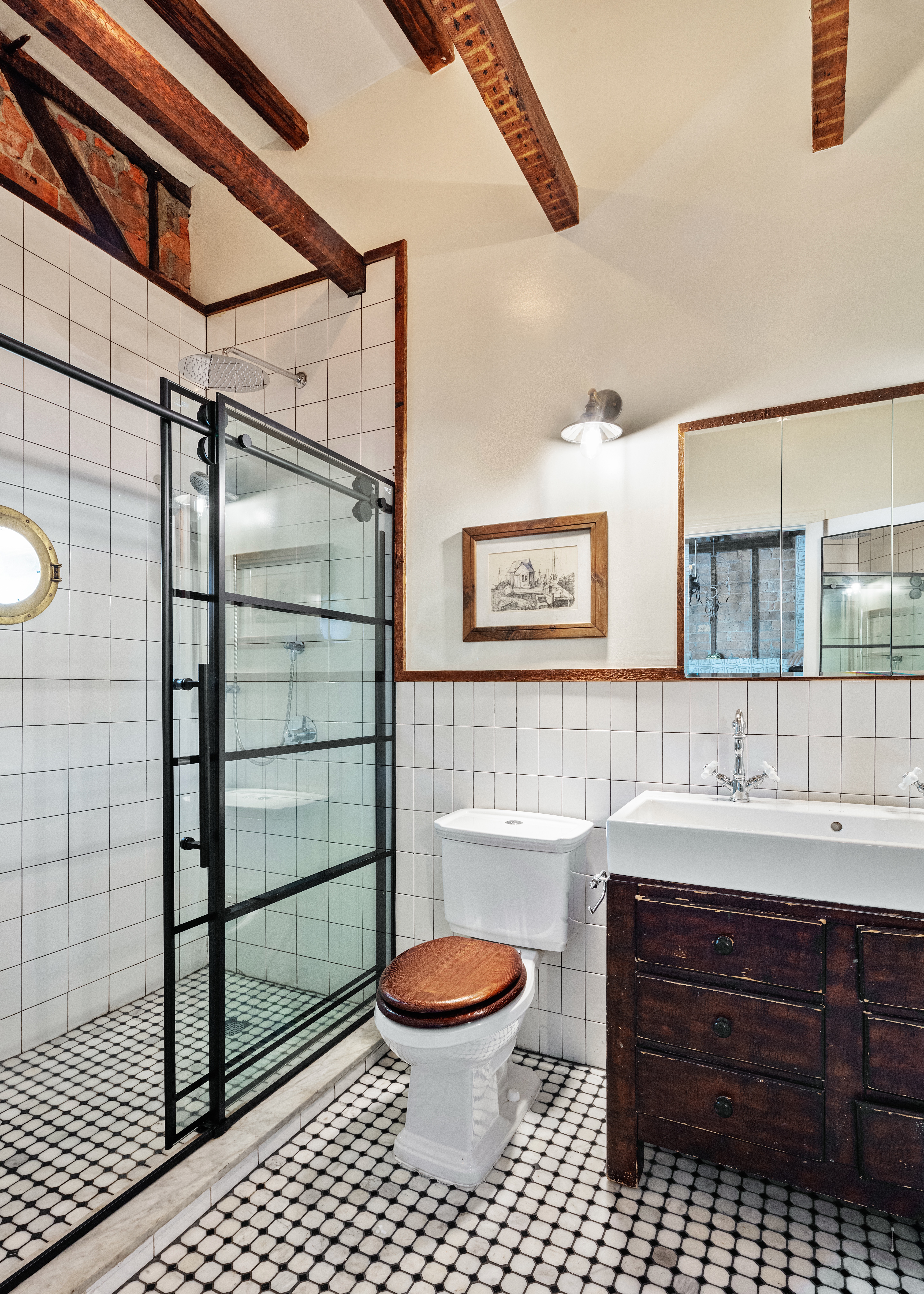 111 Powers Street Brooklyn, NY 11211 - Photo 12 of 16 a bathroom with a sink a toilet and a shower