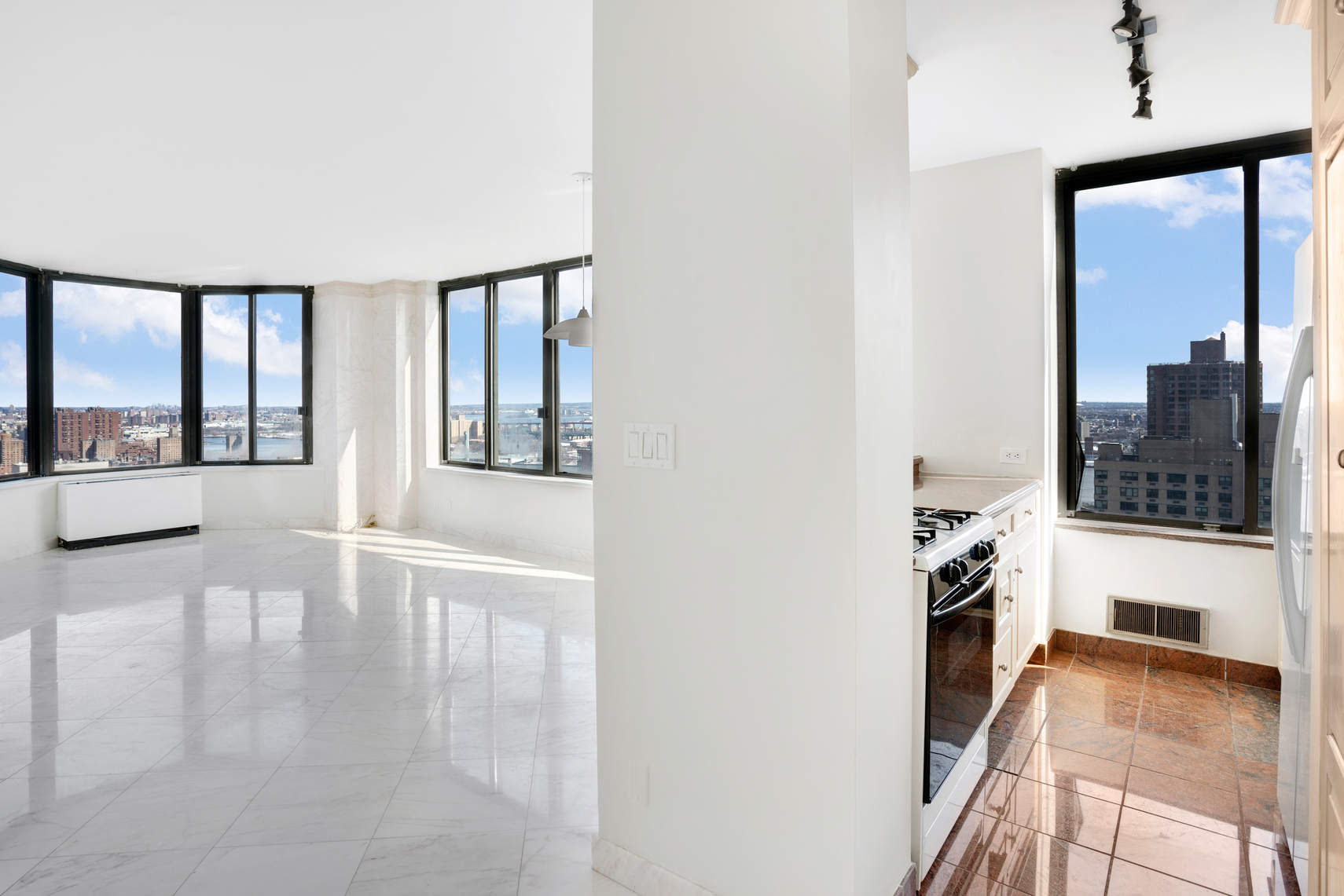 300 East 93rd Street, Unit 35D Manhattan, NY 10128 - Photo 5 of 13 a view of a living room with a large window