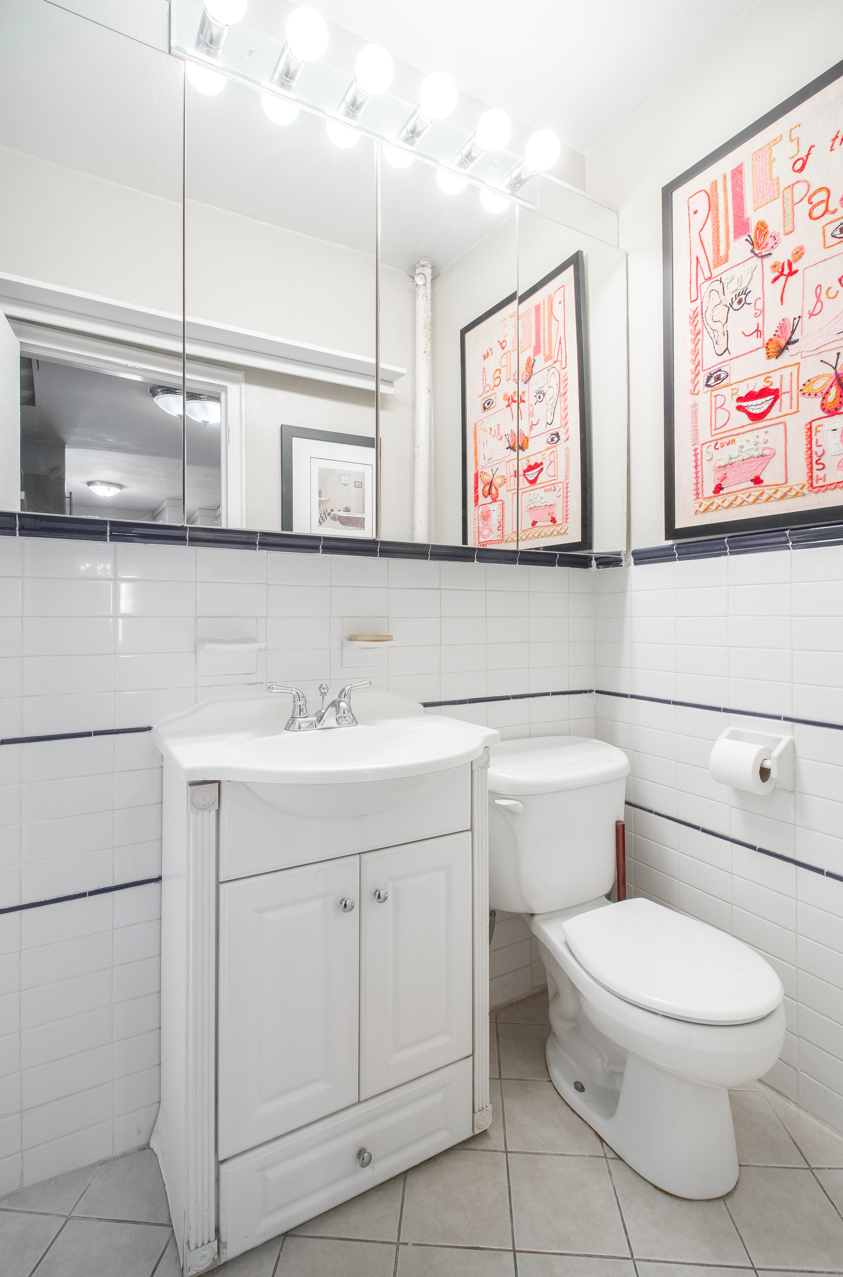 246 East 90th Street, Unit 5C Manhattan, NY 10128 - Photo 11 of 13 a bathroom with a toilet sink and mirror