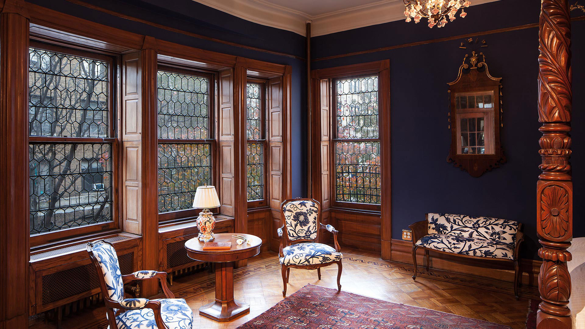 320 Convent Avenue Manhattan, NY 10031 - Photo 12 of 15 a living room with furniture and a large window