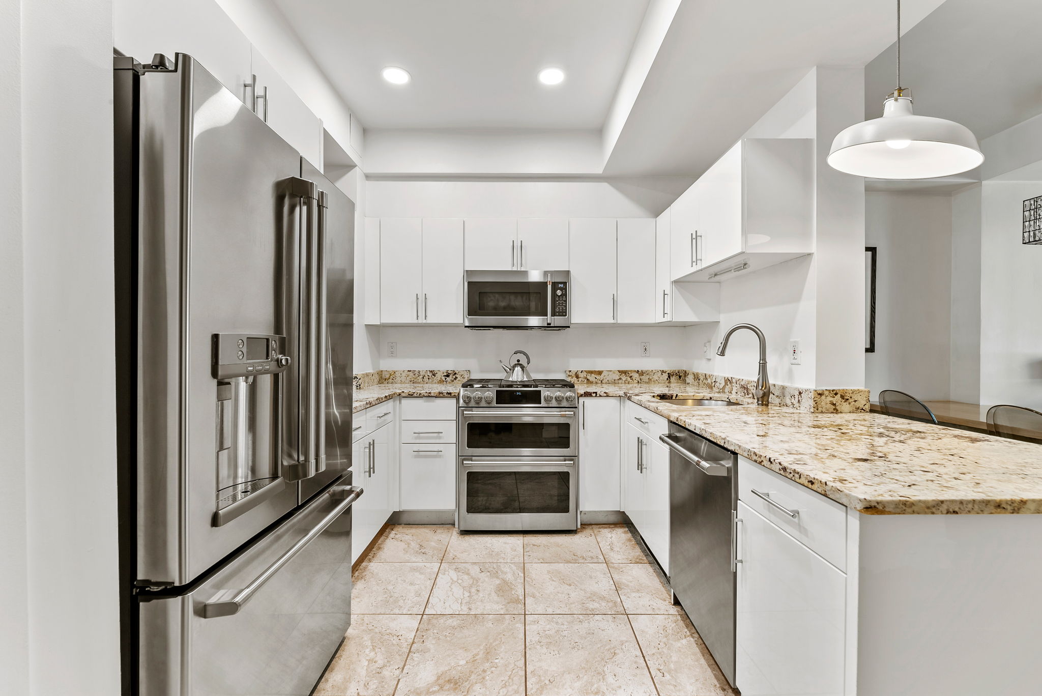 106 West 116th Street, Unit 2A Manhattan, NY 10026 - Photo 4 of 16 a kitchen with a sink stove and refrigerator