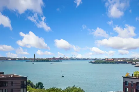 a view of a city with tall buildings