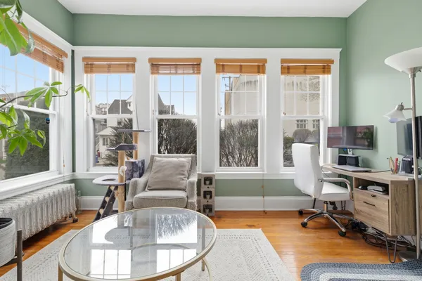 a living room with furniture and a table