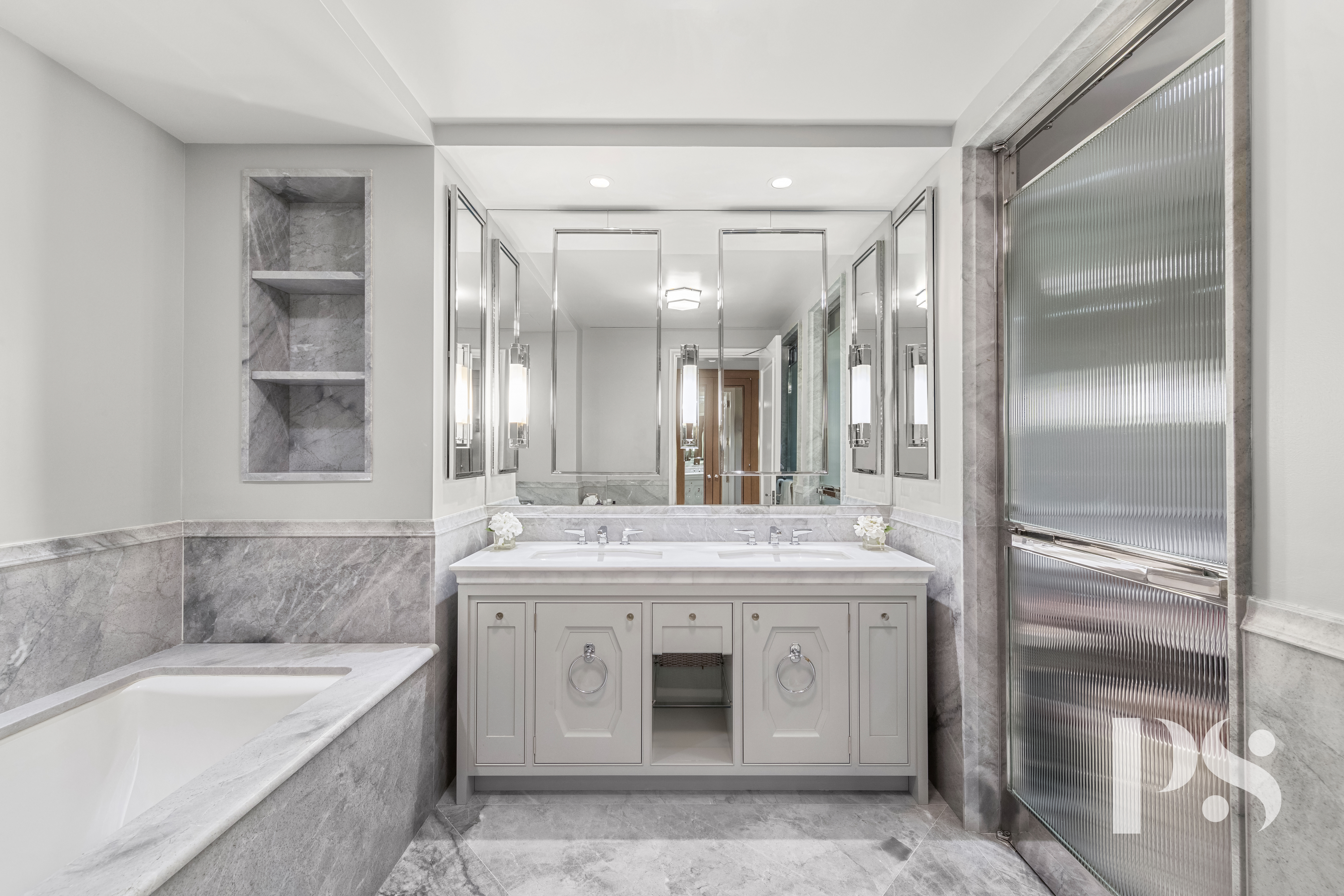 135 East 79th Street, Unit 8E Manhattan, NY 10075 - Photo 16 of 26 a spacious bathroom with a granite countertop sink mirror and a bathtub