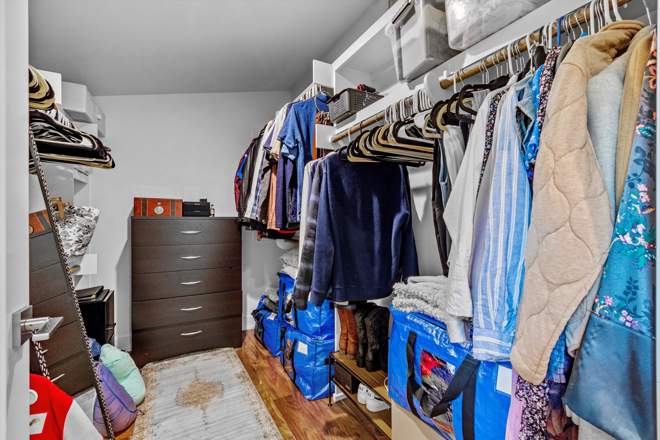 2712 Oak Springs Drive, Unit A Austin, TX 78702 - Photo 11 of 38 a view of walk in closet with clothes and shoes