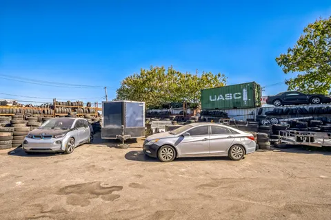 a view of car parked in front of a building